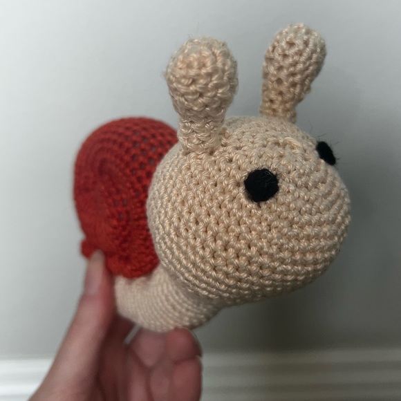 Hand a crocheted Sammy the Snail (Small)🐌 - Picture 5 of 7